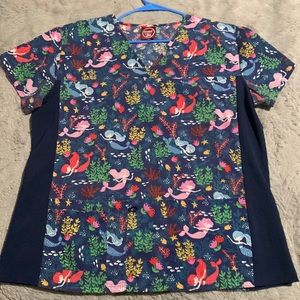 Pattern women’s scrub shirt, size XL the brand is Divine scrubs by JDM.